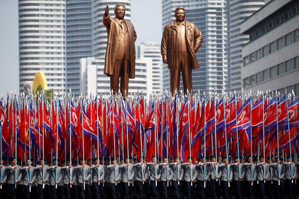  They marched past the giant statues of Kim's father and grandfather - Kim Jong-Il and Kim Il-Sung