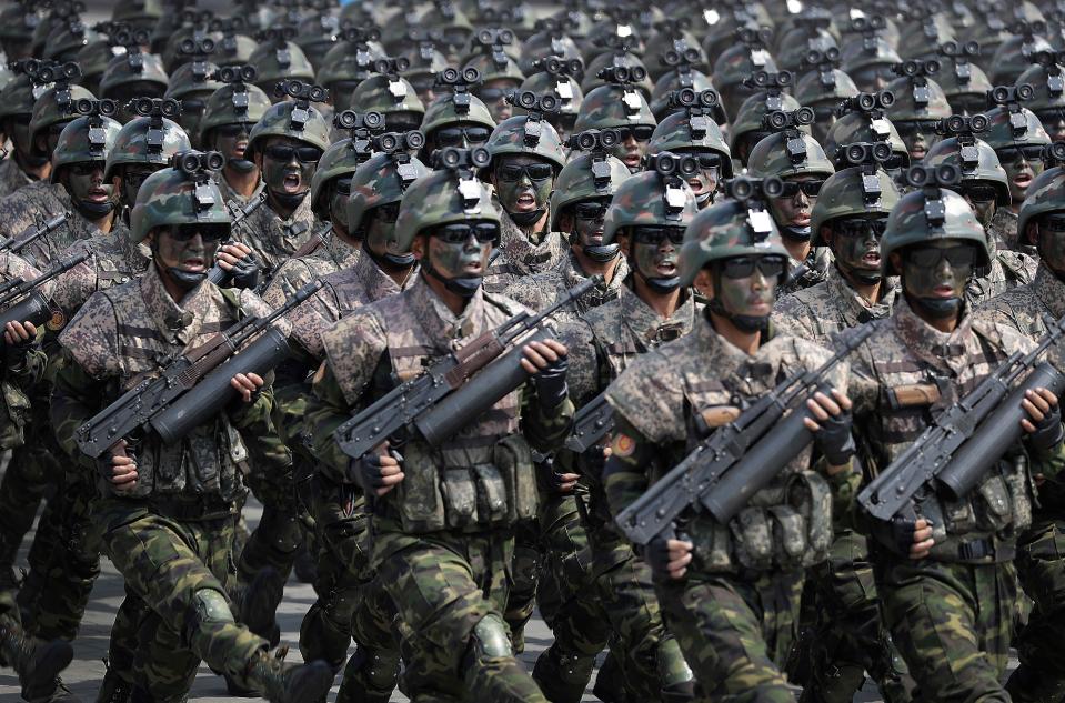  North Korean special forces march through Pyongyang yesterday. The elite troops reportedly train to snatch Westerners from South Korea