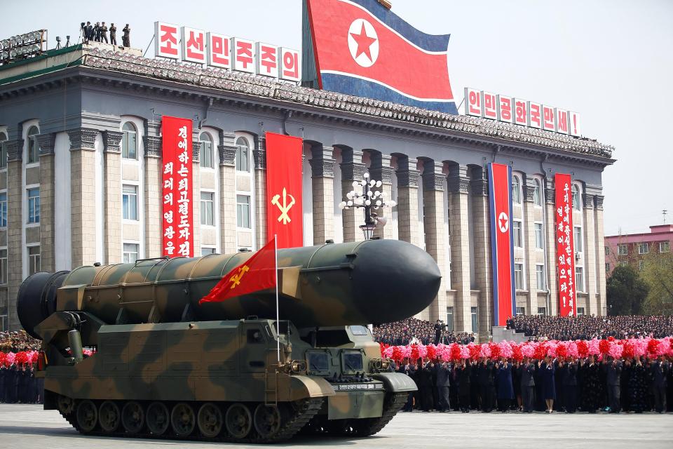  A missile is driven past Kim Jong-un during a recent military parade in Pyongyang