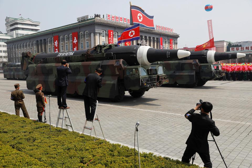  North Korea's military arsenal was paraded through Pyongyang in a military show of strength - but experts warn they may be fake. The KN-08 missile is pictured