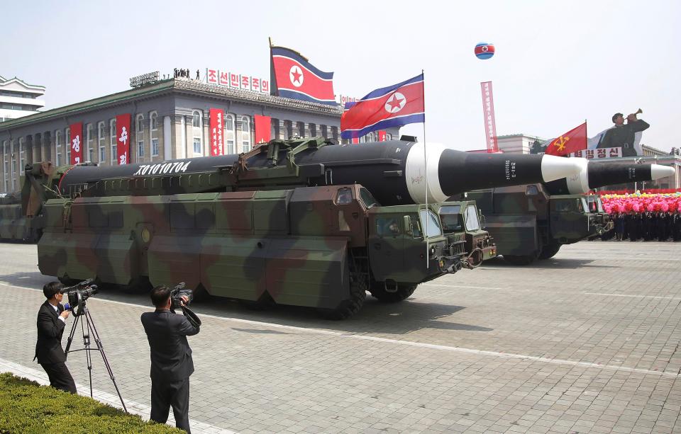  What military experts say appears to be a North Korean KN-08 Intercontinental Ballistic Missile (ICMB) is paraded across Kim Il Sung Square during a military parade