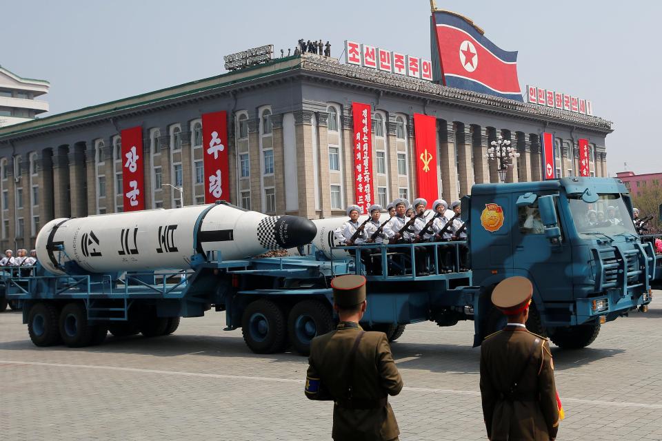  A missile is transported through the streets during the parade, seen as a show of force to President Trump