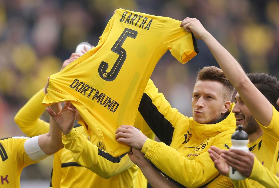  Marco Reus holds up the jersey before kick-off against Eintracht Frankfurt