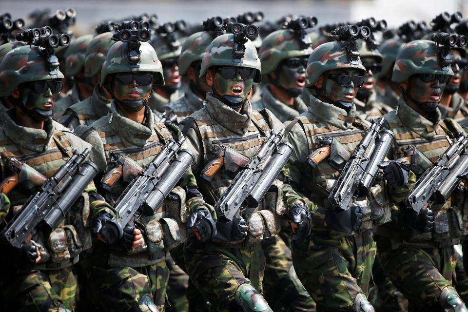  North Korean special forces soldiers march and shout slogans during a military parade marking the 105th birth anniversary of country's founding father, Kim Il Sung in Pyongyang