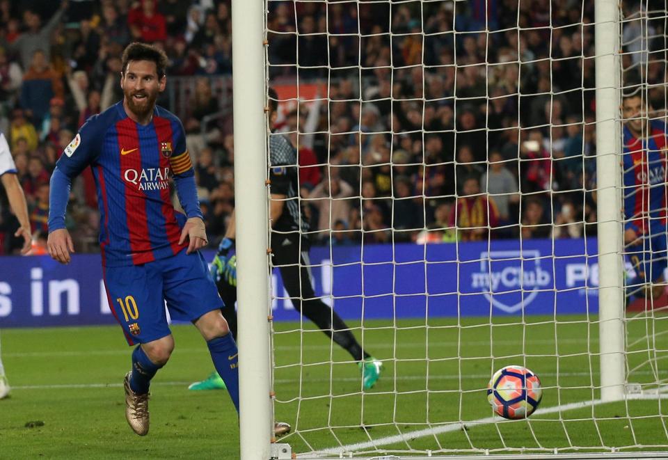  Lionel Messi watches the ball trickle in as he bumbles home his second of the evening