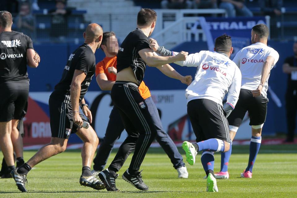  Lyon's players ran for the stands as Bastia ultras stormed the pitch