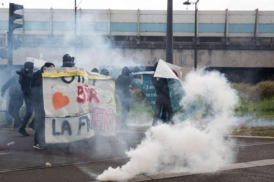  The protests soon turned ugly and police fired tear gas to disperse the crowds