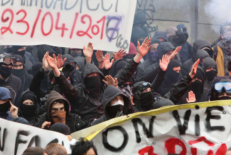  Menacing masked demonstrators clashed with cops ahead of Marine Le Pen's rally