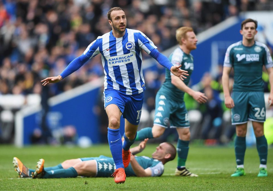  Glenn Murray bagged himself a goal as Brighton almost certainly secured promotion against Wigan