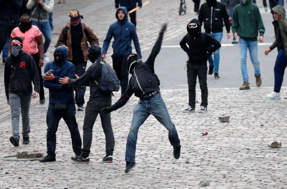  Some threw huge rocks at officers standing between them and the FN event