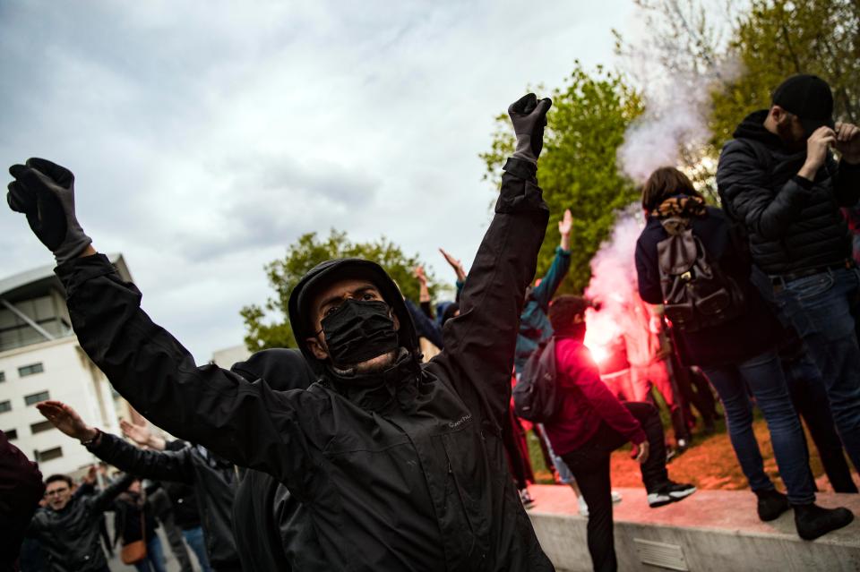  The protests began to turn ugly as troublemakers hurled missiles at riot cops