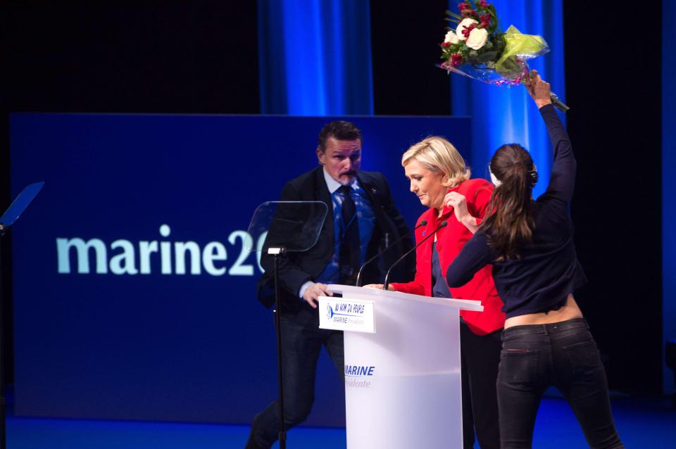  Marine Le Pen was attacked by a woman wielding a bunch of flowers on stage