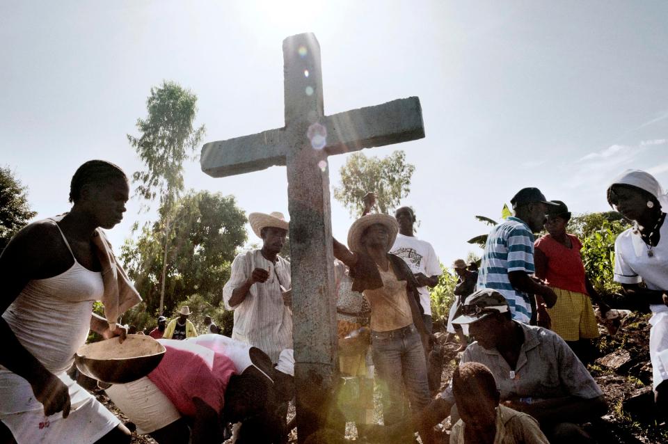  From all over Haiti, prayers on the trail of mud leading to the cathedral of Saut d'eau. it is said that 85 per cent of Haitians are Catholic and 100 per cent voodoo engage