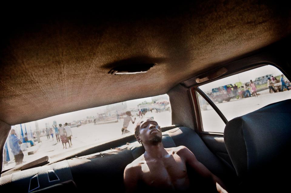  Pouchon 24 years old, is relaxing inside Maurice’s car