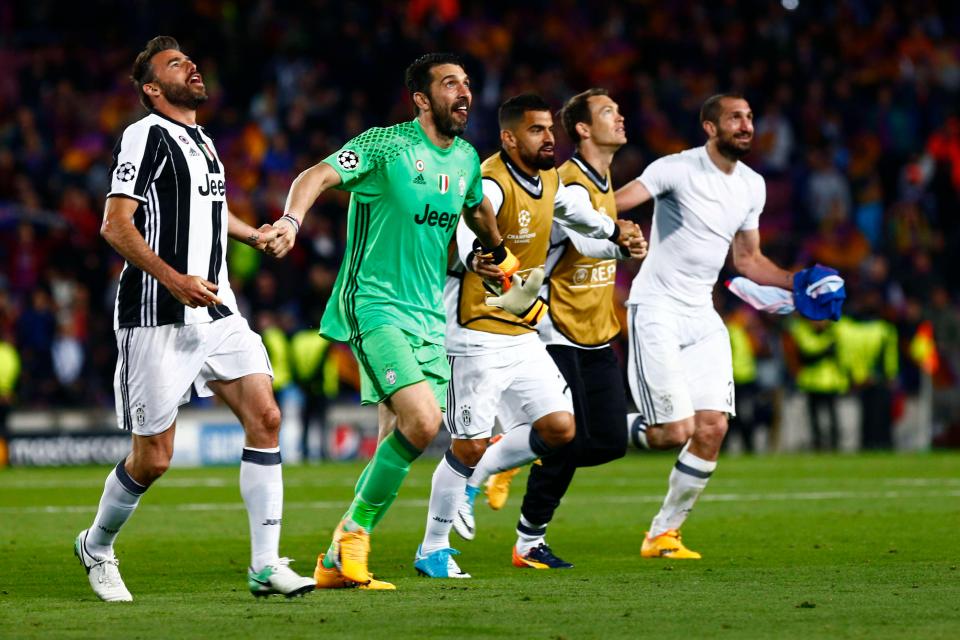  The Juventus players at the end of the match celebrate with the travelling fans after knocking out Barcelona