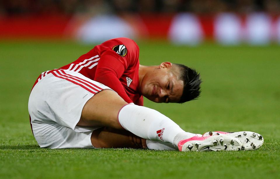  Marcos Rojo tried to continue to fell to a heap after another collision