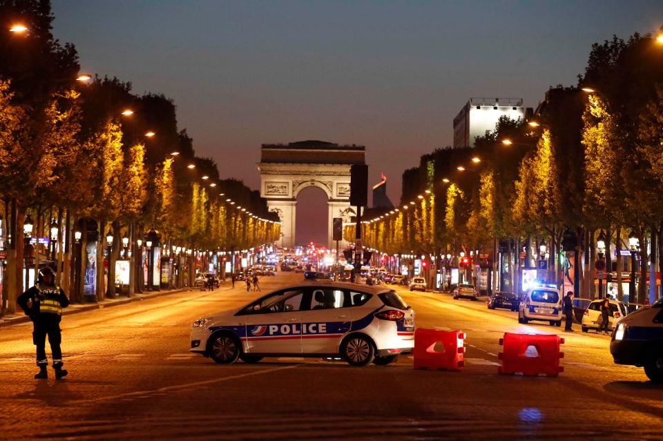  Three policemen have been shot - one dead - on the Champs-Elysees in Paris