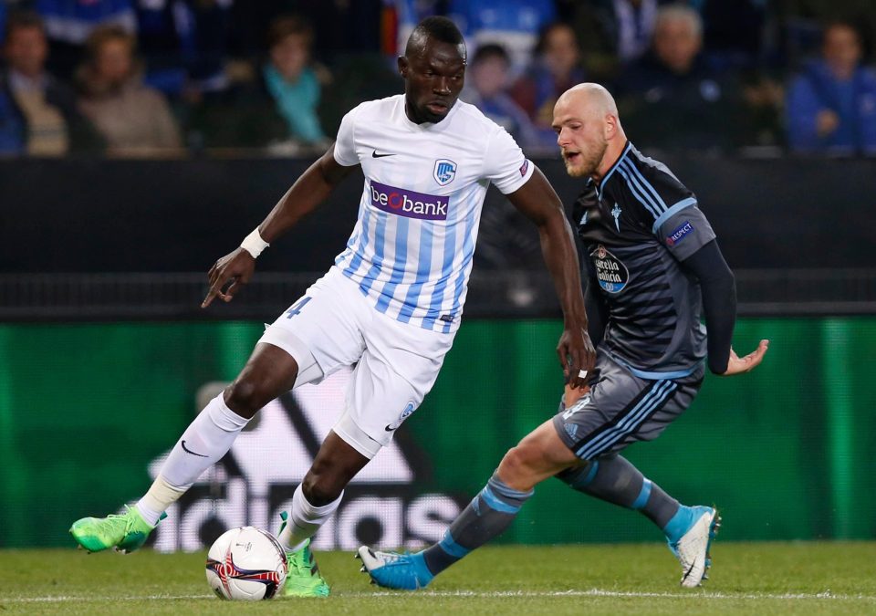  Genk star Omar Colley fends off experienced Swedish striker John Guidetti