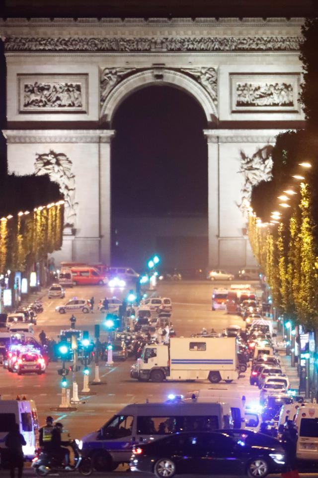  Emergency services line up on the Champs-Elysees near the Arc de Triomphe