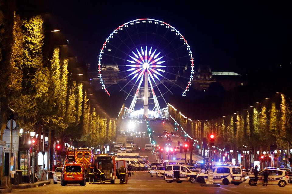  Emergency crews fill the famous shopping street, a hub for tourists that runs from Place de la Concorde to the Arc de Triomphe