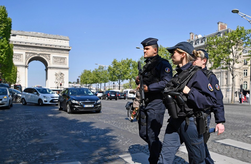 Armed police were spotted patrolling the Champs Elysees following the shooting of a police officer