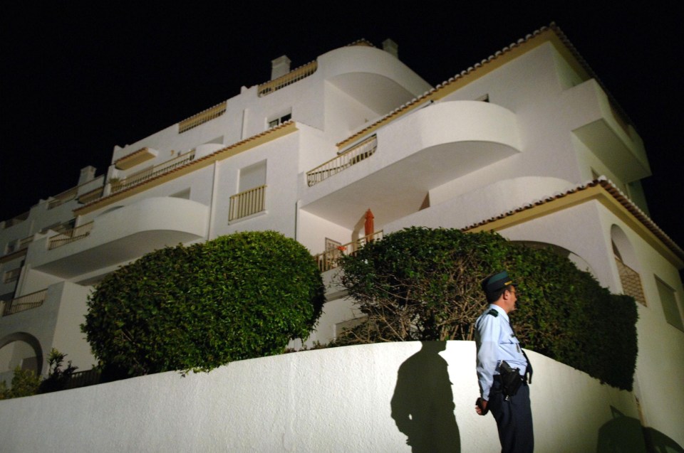 A police officer stands outside the apartment at the Ocean Club Hotel in Luz, Portugal, where Madeleine McCann went missing