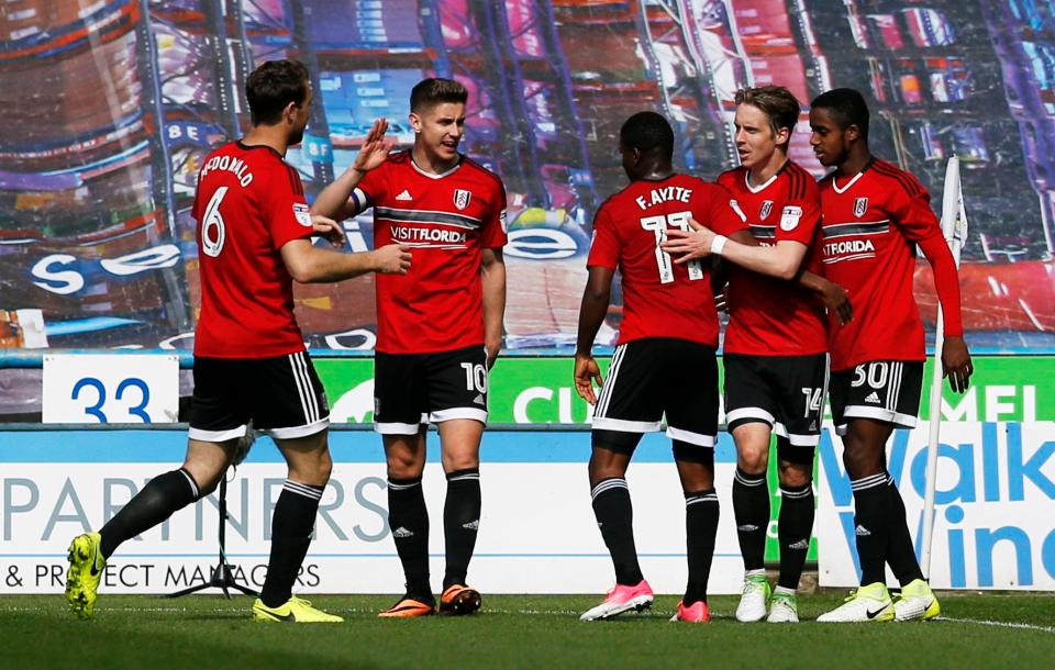  Stefan Johansen and Fulham celebrate after they scored FOUR first-half goals to beat Huddersfield