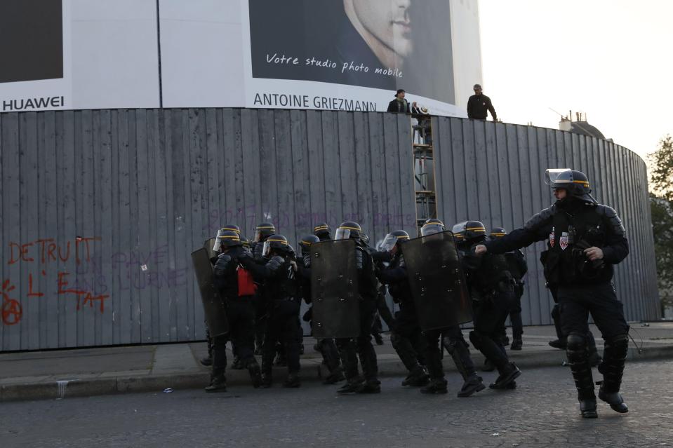  Cops peppered the crowds with tear gas as the scenes became rowdier and riot police surrounded the area