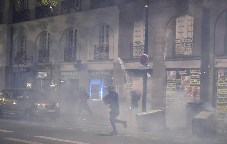  Chaotic scenes saw groups of angry young people going up against police carrying shields and wearing helmets