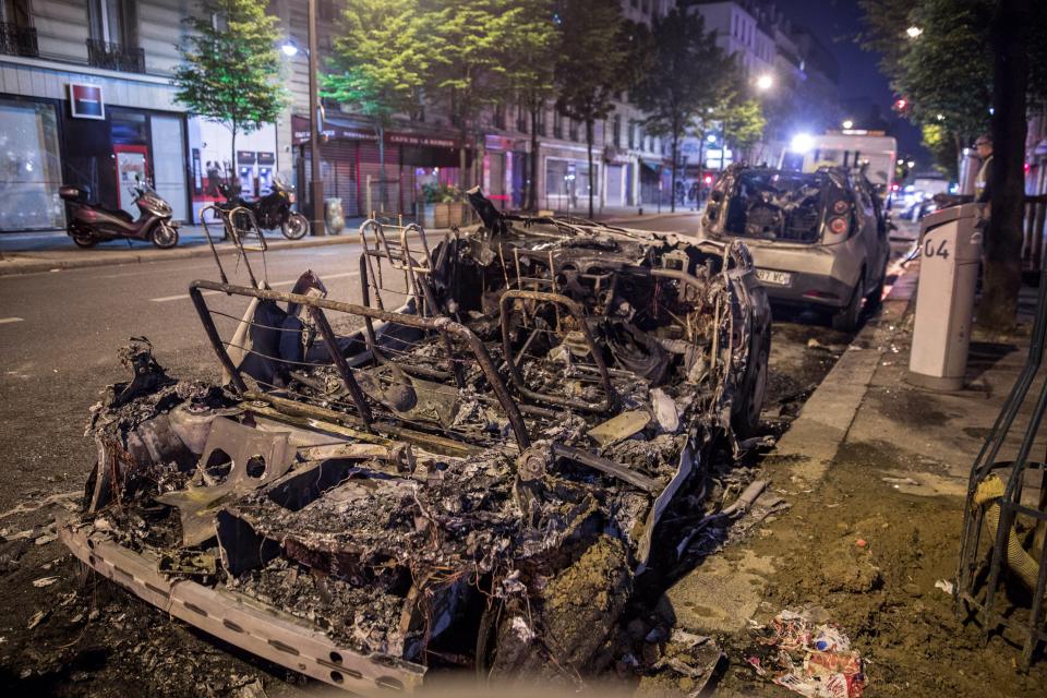  Rioters set fire to cars as violent clashes on the Parisian streets continued through the night