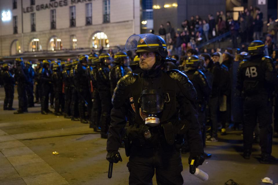  Riot police pictured last night in the French capital