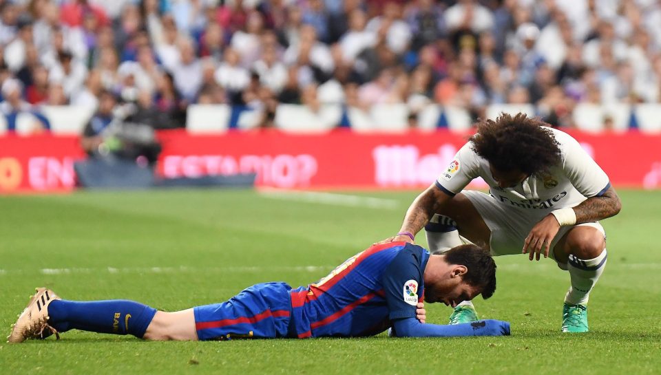 Marcelo Vieira pats Lionel Messi on the back - before the Barcelona superstar got up to sink Real on the floor and Marcelo Vieira