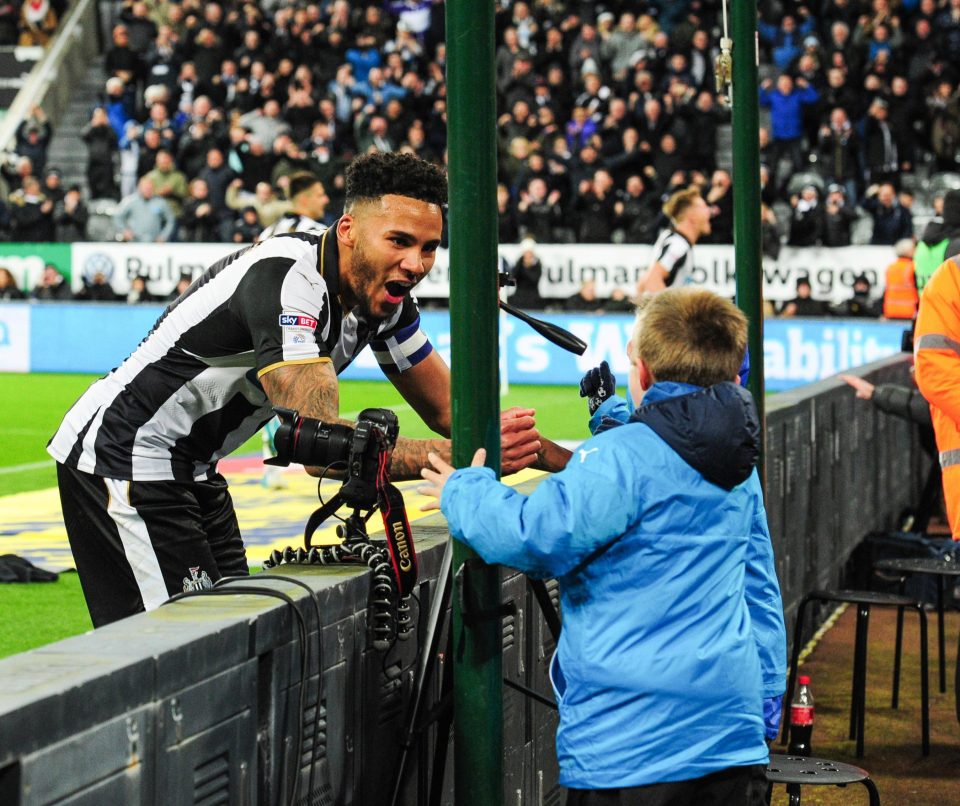  Jamaal Lascelles of Newcastle United celebrates with ballboys after Newcastle's third goal