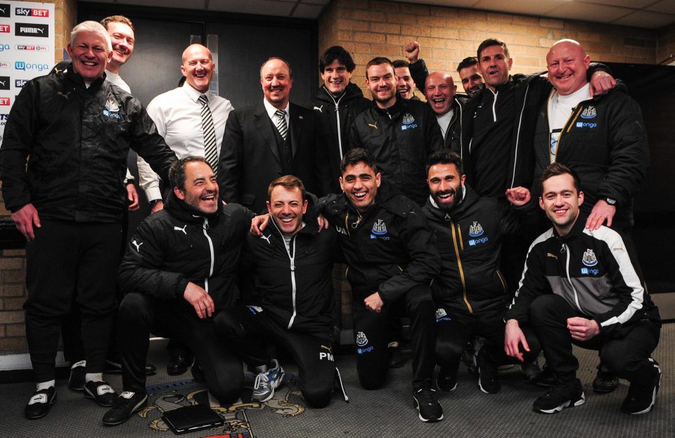  Manager Rafa Benitez (back row, centre) celebrates with his backroom team