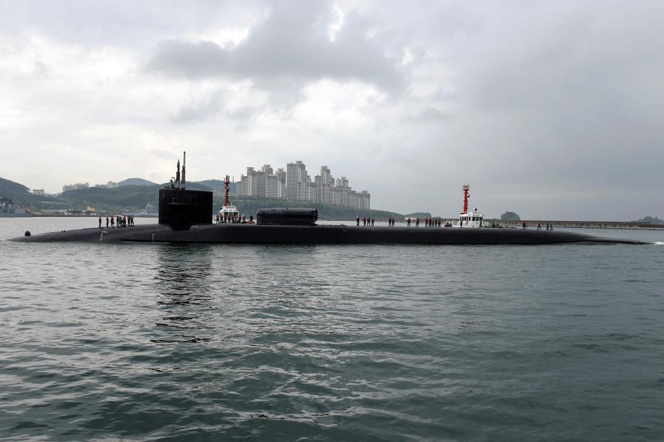  The USS Michigan, an Ohio-class nuclear-powered submarine, arrives at a naval base in Busan, South Korea