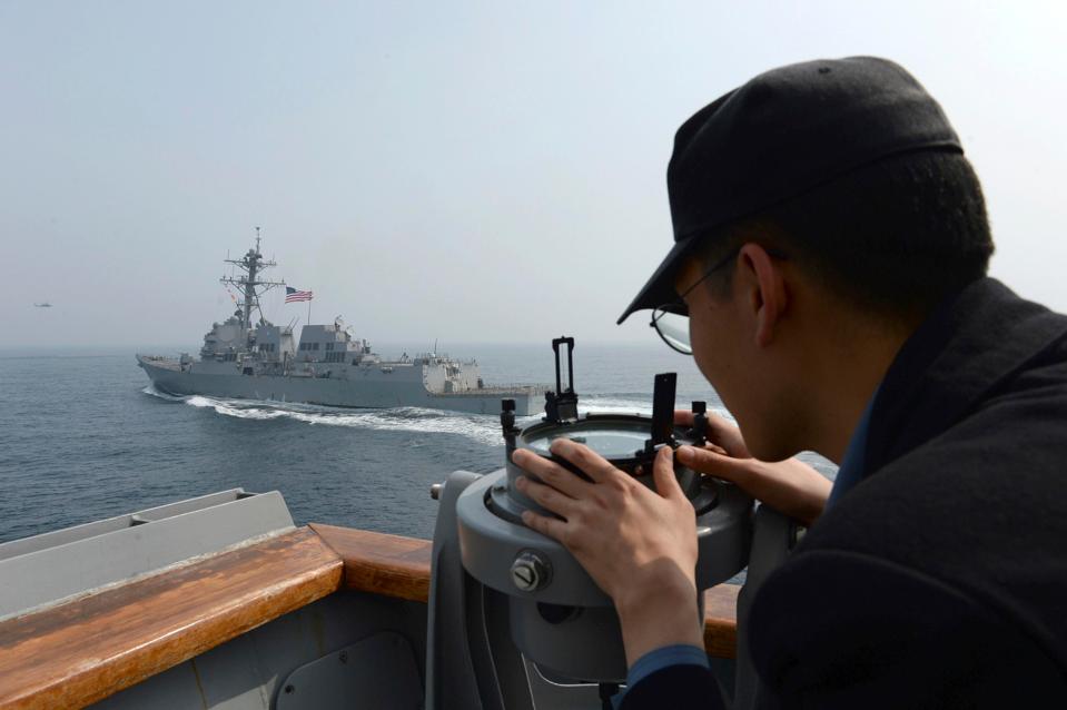  A South Korean navy sailor watches the destroyer USS Wayne E. Meyer during a joint exercises between the United States and South Korea in South Korea's West Sea