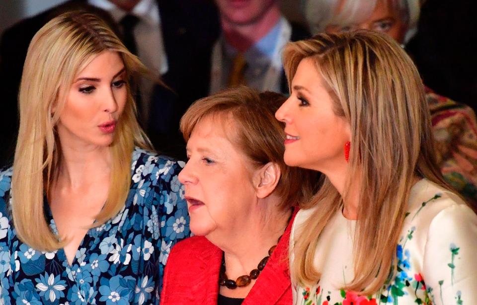  German Chancellor Angela Merkel (centre), Queen Maxima of the Netherlands (right) and Ivanka Trump (left) arrive for a group picture before participating in the panel 'Inspiring women: Scaling Up Women's Entrepreneurship'