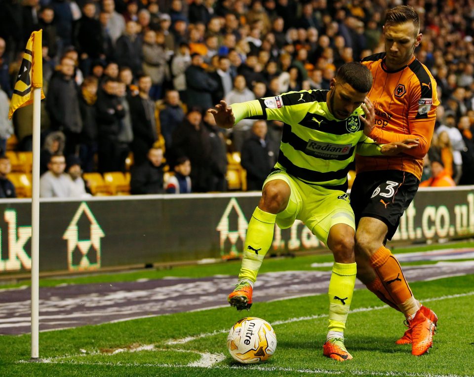  Nahki Wells shields the ball as Huddersfield try to overcome missing out on automatic promotion