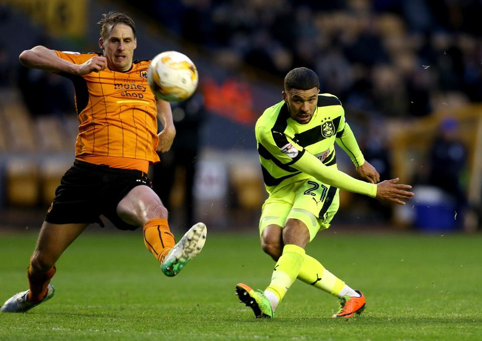  Nahki Wells blasts in an effort on the Wolves goal as Huddersfield get on top