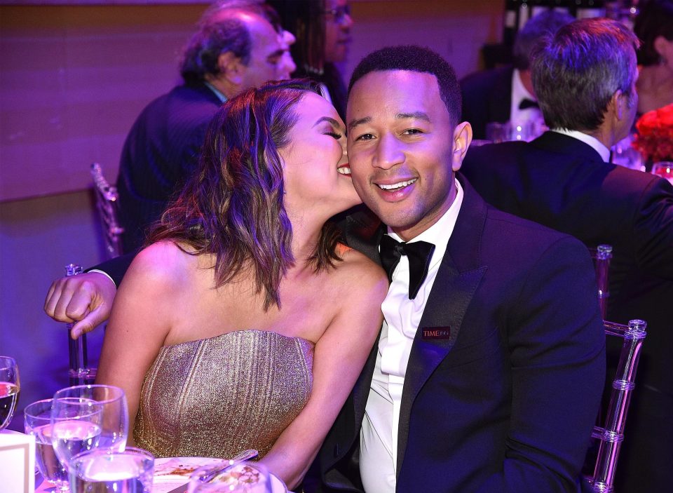  John Legend and Chrissy Teigen sit down for the awards ceremony at the Lincoln Centre