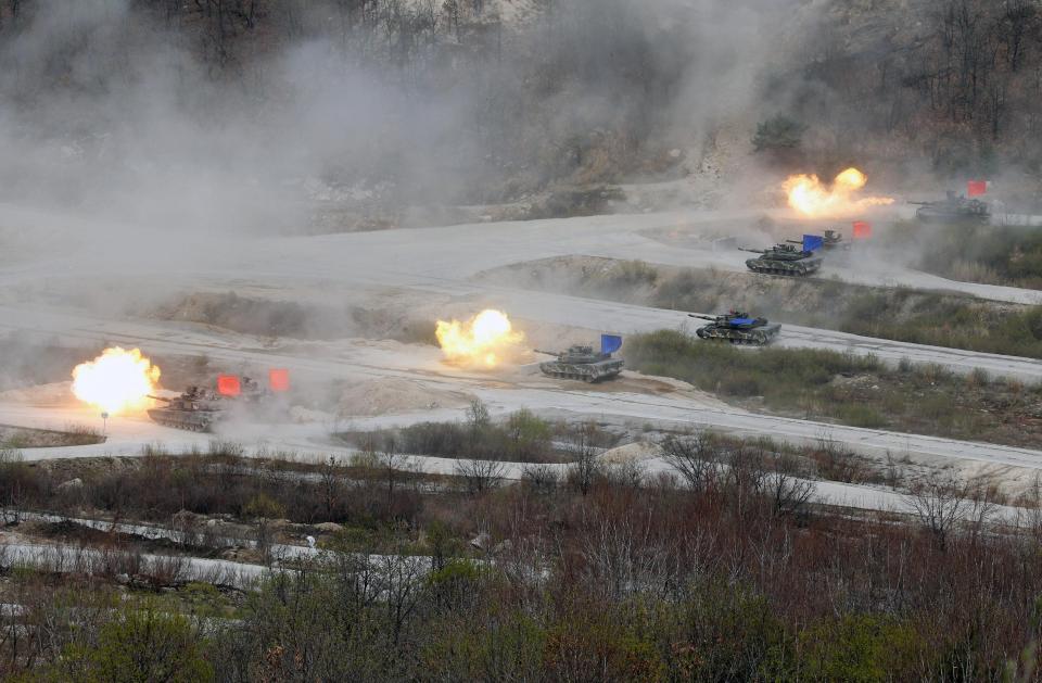  South Korean Army K1A1 and U.S. Army M1A2 tanks blast their way forward