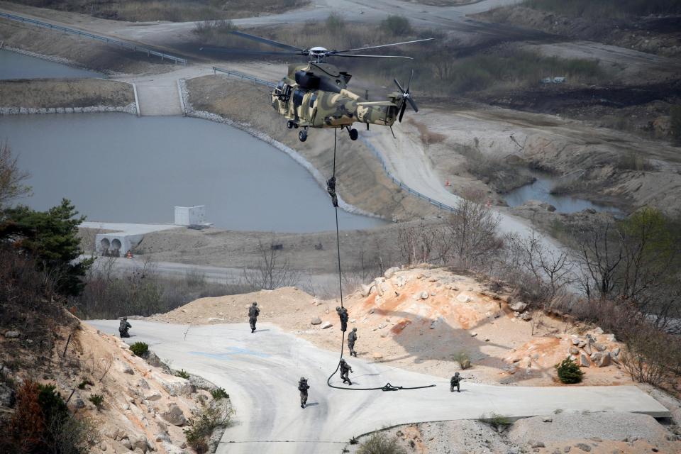  South Korean Army soldiers rappel down in the rapid pace military exercises which envisage fighting fanatical North Koreans