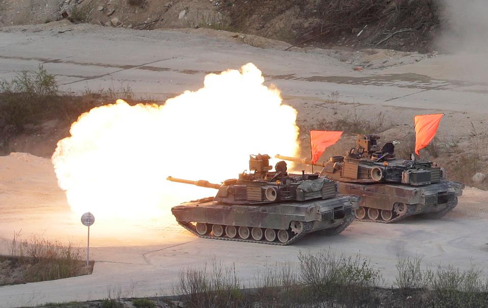  The US Army's M1 A2 tanks converge on the firing line and fire at the target