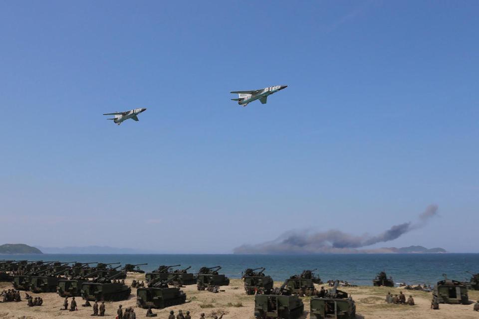  North Korean warplanes roar over the fire demonstration of the Korean People's Army