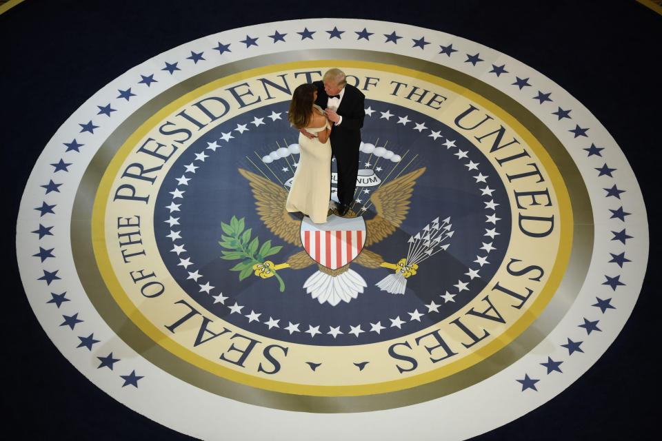  Donald Trump shares a dance with First Lady Melania who said she would spend much of the first 100 days away from Washington DC