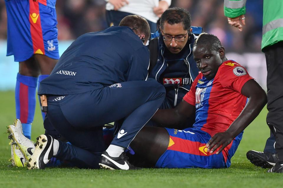  Mamadou Sakho looks in a lot of pain as he is helped by medics