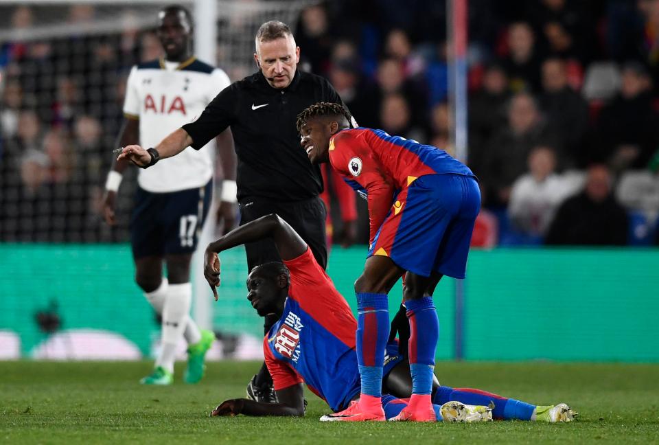  The defender landed awkwardly on his knee and signalled for help instantly