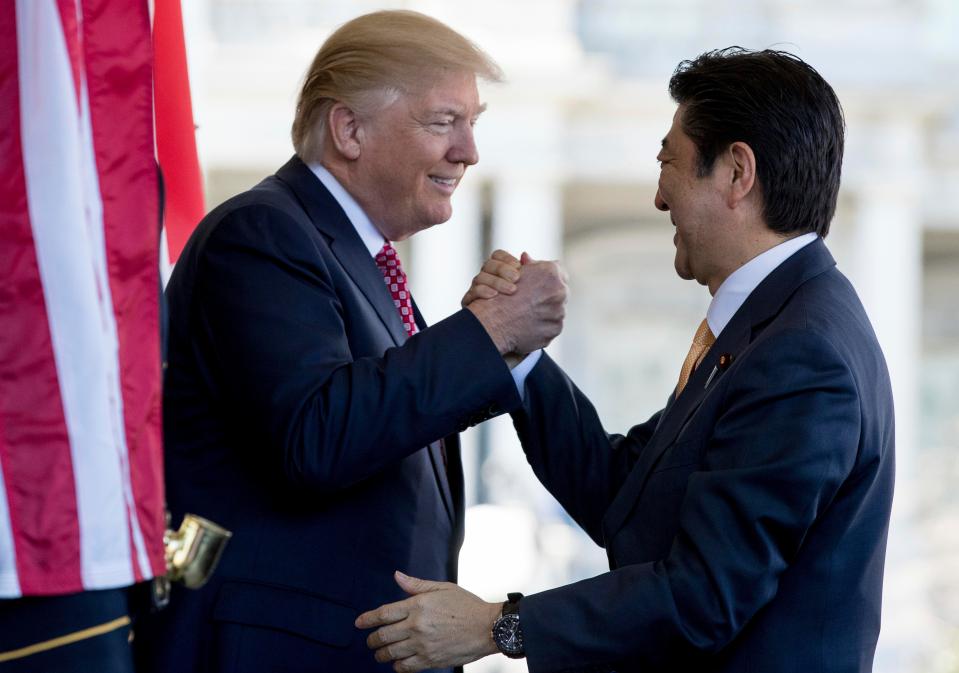 Best buddies ...Japanese Prime Minister Shinzo Abe is greeted by U.S. President Donald Trump, left, ahead of their joint news conference at the White House on February 10