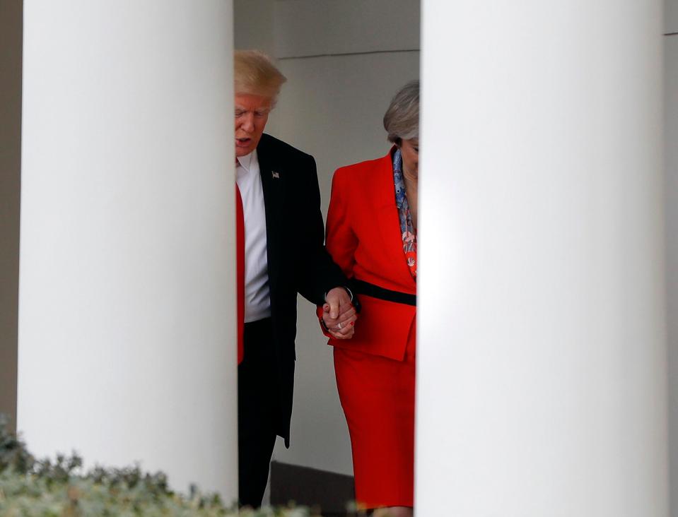  Trump clasps Theresa Mays hand as they walk down a slope at the White House. The President is thought to suffer from bathmophobia, which is a fear of slopes and stairs