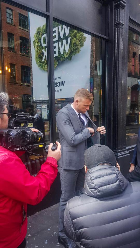  Flintoff reaches into his pocket as cameramen film him during the shoot